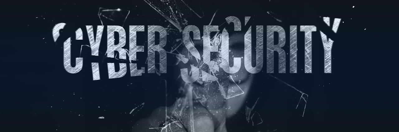 A concept image with the word cybersecurity being shattered by a hacker.