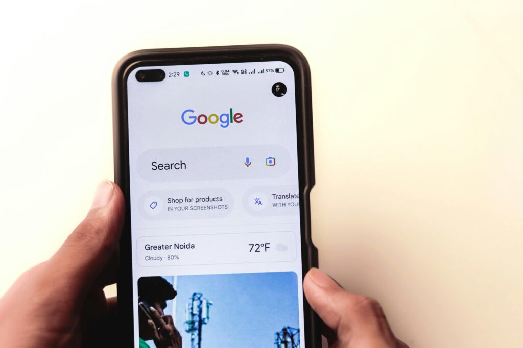 Google search page on a mobile screen highlighting SEO troubleshooting by a website design agency in Singapore