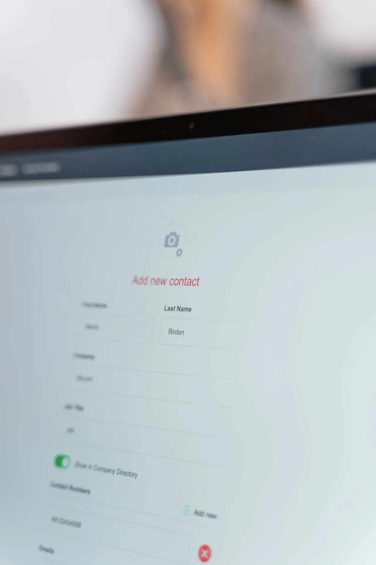User interacting with an online contact form and directory interface, highlighting how form design impacts website conversion and enquiry rates.