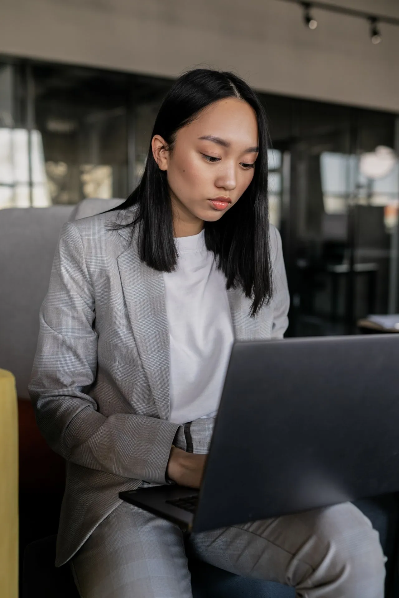 Business professional reviewing a website user experience and digital interface on a laptop.