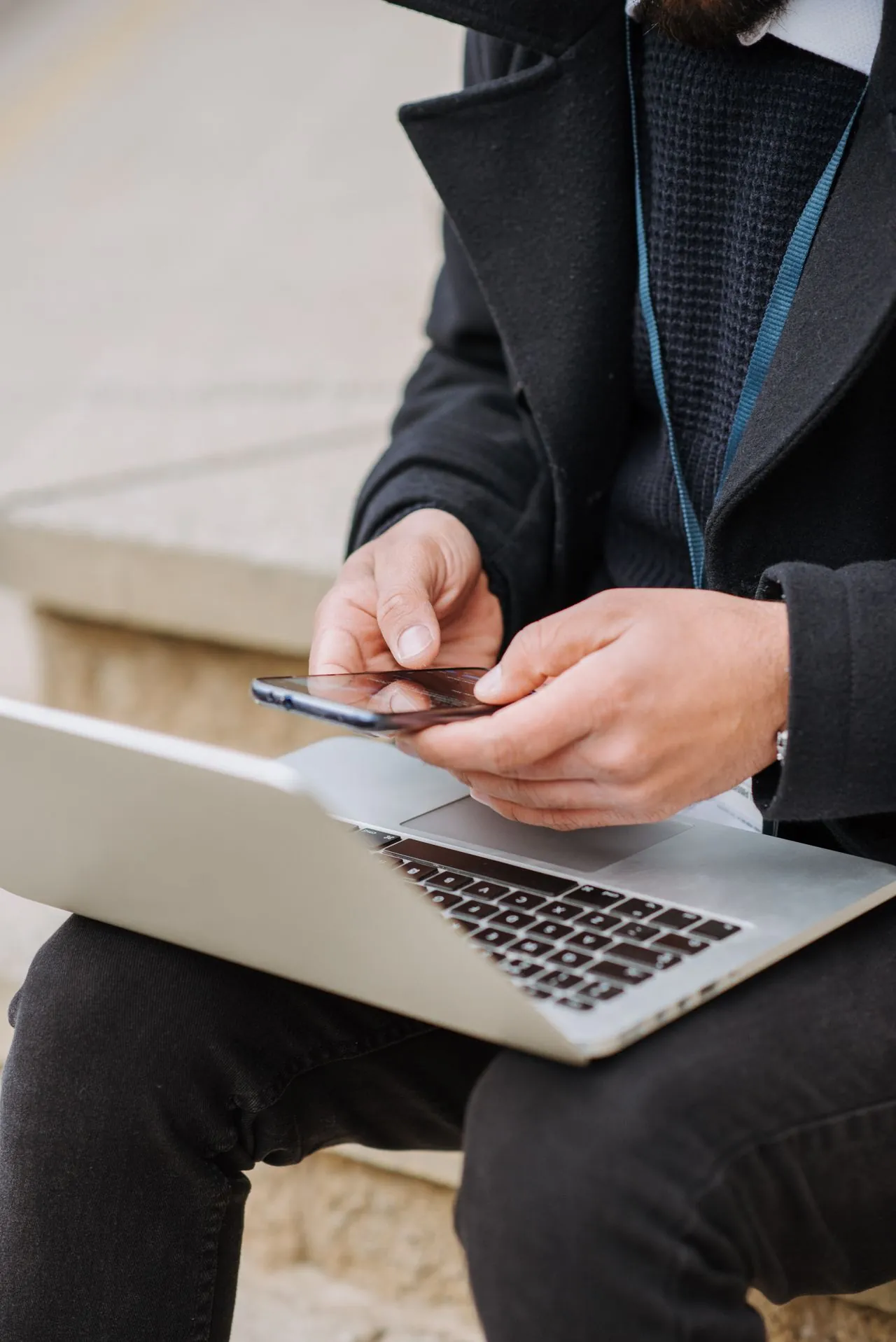 User interacting with a responsive business website designed for seamless desktop and mobile experiences.
