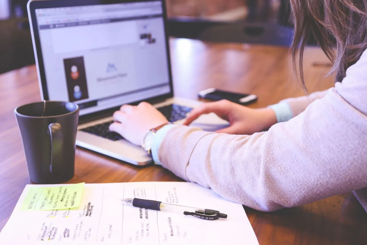 Business professional reviewing website integrations and digital workflows during a web development project.