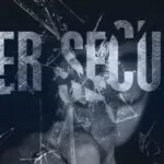 A concept image with the word cybersecurity being shattered by a hacker.