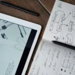 1 Notebook and pen symbolising content planning by a web design agency Singapore focused on engagement