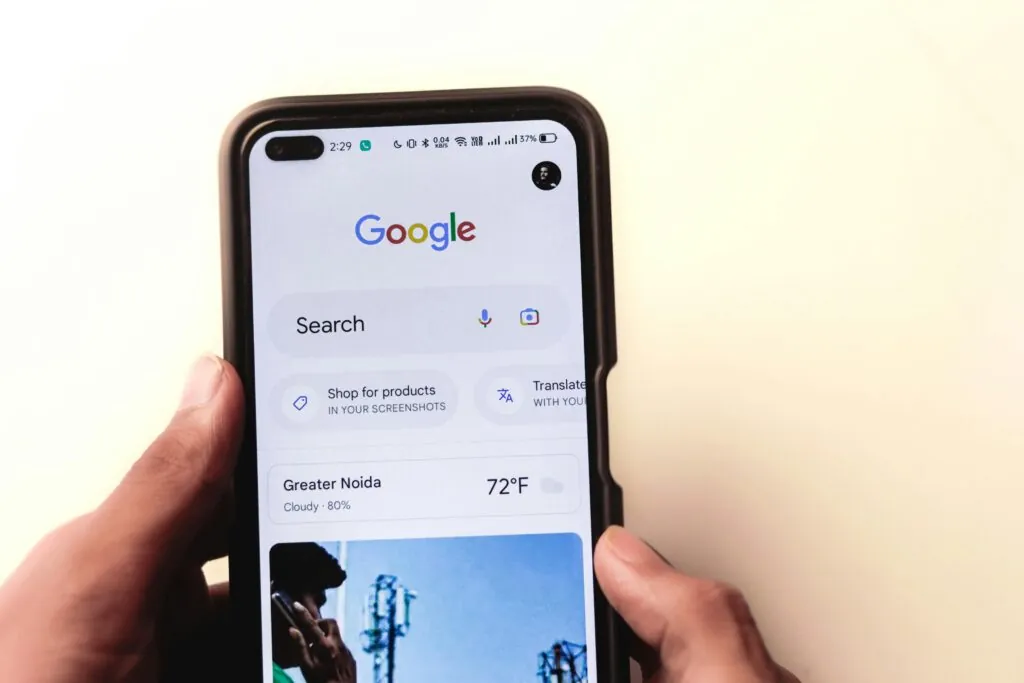 Google search page on a mobile screen highlighting SEO troubleshooting by a website design agency in Singapore