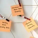 Work reminder notes symbolising email marketing by a web designing agency to build client relationships